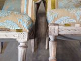 two chairs sitting next to each other in a room