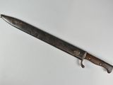 a knife that is laying on a white surface