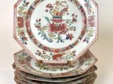four plates stacked on top of each other on a table