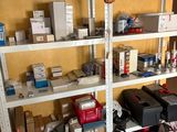 many boxes and boxes on the shelves in the room