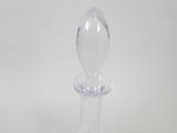 a clear glass bottle with a glass stopper on it