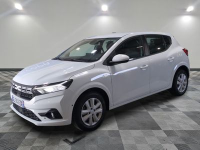 a white car parked in a room with a checkered floor