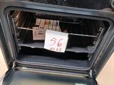 a note taped to the inside of an oven door