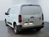 citroen van parked in a large room with a white wall