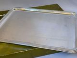 a silver tray sitting on top of a green box