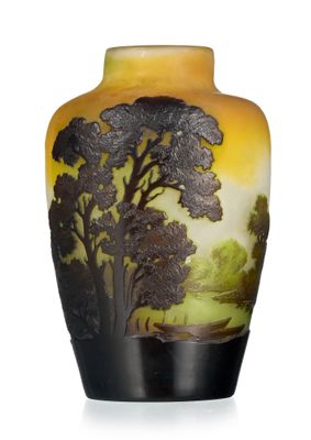 a vase with a painting on it sitting on a table