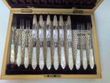 a wooden box with a set of silverware in it