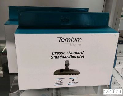 une boîte sur laquelle est posé un aspirateur