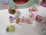 a lot of littlest pet shop figurines on the table