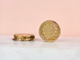 a close up of a coin sitting on top of a marble counter