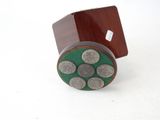 a small wooden box with a green and silver design