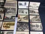 a lot of old postcards that are on the table