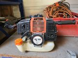 a small blower sitting on top of a table in a garage