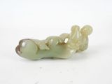 a small figurine of a woman laying on her stomach