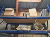 a blue cart with a bunch of boxes on it