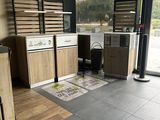 a kitchen with a pizza on the floor in front of a large window