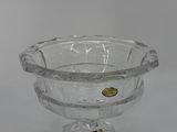 an image of a clear glass bowl with gold accents on a pedestal