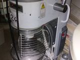 a machine that is sitting on the floor next to a sink