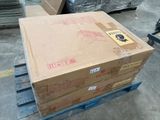boxes on a pallet in a warehouse with a hand truck in the background