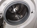 a washing machine that is sitting on the floor