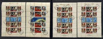 two stamps with different images of people on them on a table