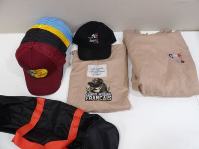 many different hats and other items on a table