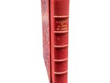 a red book that is sitting on top of a table