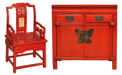 a red cabinet and a red chair next to each other