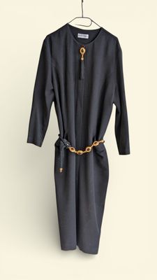 an image of a black dress hanging on a hanger
