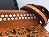 a musical instrument that is sitting next to a bag