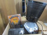 a box with a television, a remote, a keyboard, and other electronics