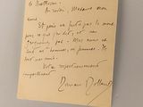 a piece of paper on a refrigerator door with a note attached to it