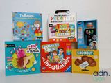 many children ' s books and toys on the table