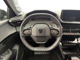 the interior of a car with a steering wheel and dashboard controls