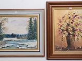 two paintings of flowers are hanging on a wall next to each other