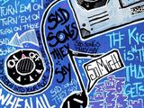 a painting of a boomboard with a lot of graffiti on it