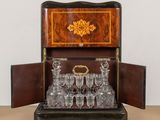 a wooden box with a set of wine glasses in it