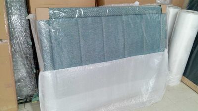 many rolls of plastic wrap on the floor in the room
