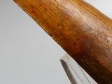 a large wooden object that is on a glass stand