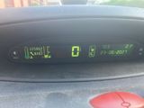 a digital clock on the dashboard of a car