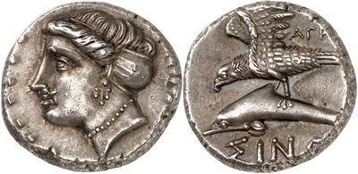a silver coin with an image of a woman and a bird on it