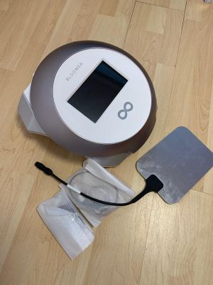 a vacuum that is sitting on the floor next to a piece of paper