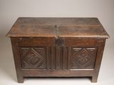 an old wooden chest with two doors and a latch on the top