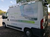 a van that is parked on the side of the road