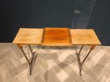 an image of a wooden table with two trays on top of it