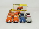 several toy cars are lined up in a row in front of a box