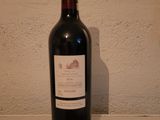 a bottle of wine sitting on a table with a number on it