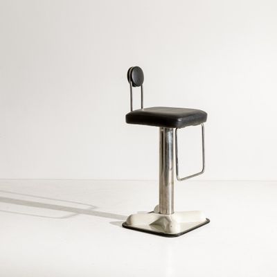 a black stool with a black seat on a white surface