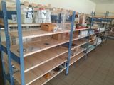 many shelves that have items on them in the store
