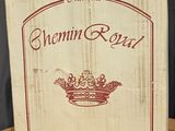 a wooden box with a crown on it on a table